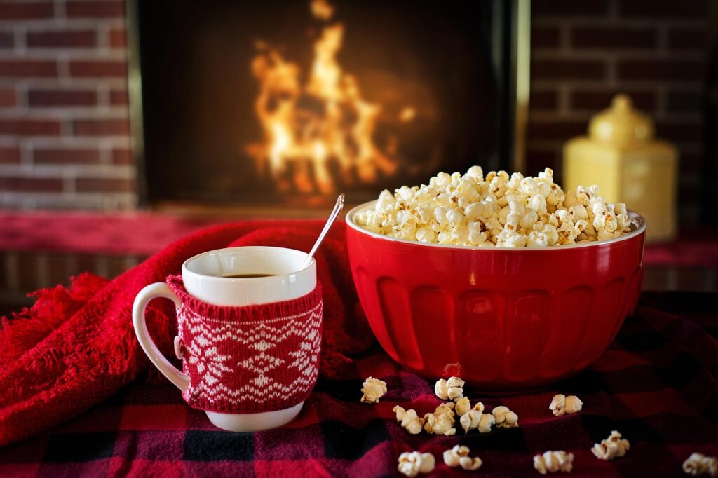 Fire burning in a fireplace on a winter evening, like the film's final scene