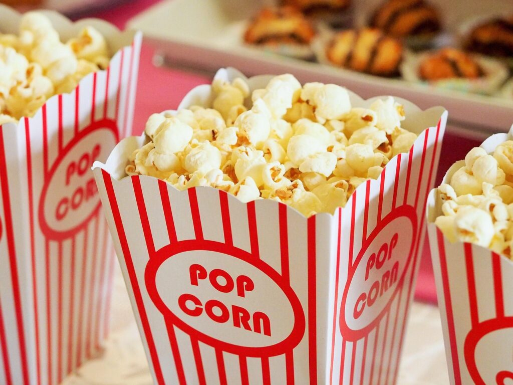Popcorn and drinks set out for a movie marathon before Deadpool and Wolverine